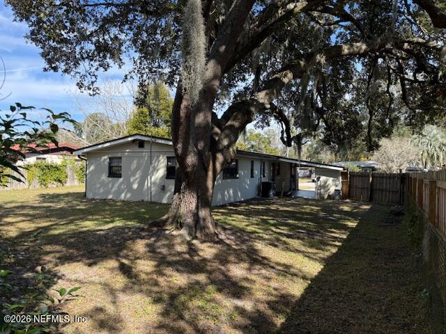8114 Fresca Street Jacksonville, FL 32217 - Photo 28 of 29 a tree in front of a white house