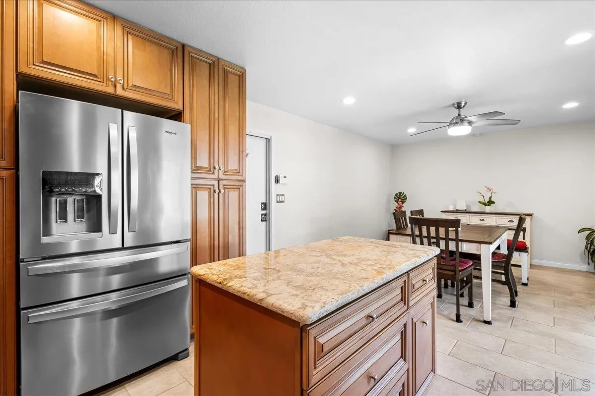 10738 2nd Street Santee, CA 92071 - Photo 8 of 52 a kitchen with a refrigerator and countertop