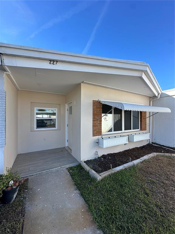 a view of backyard with seating space