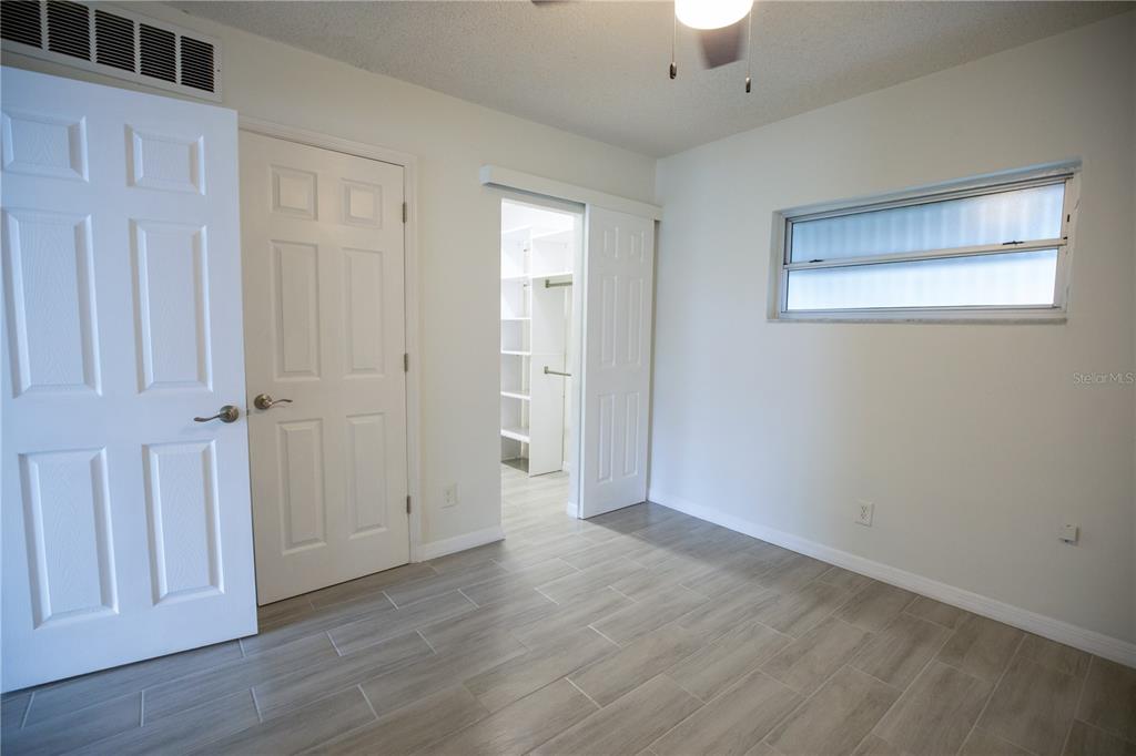 250 Rosery Road Northwest, Unit 227 Largo, FL 33770 - Photo 12 of 18 wooden floor in an empty room