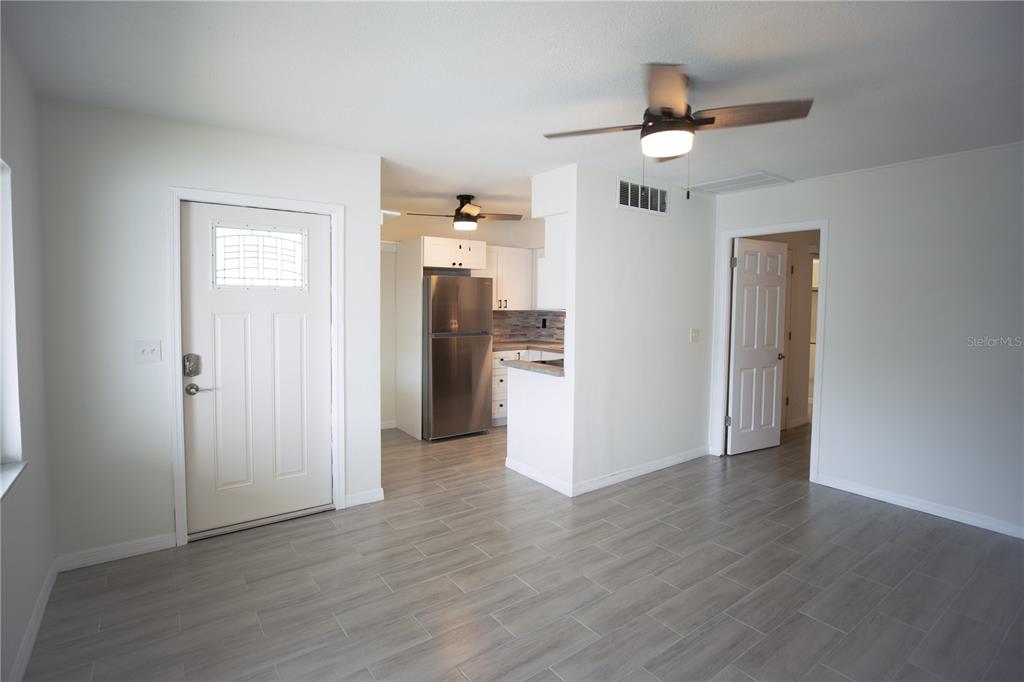 250 Rosery Road Northwest, Unit 227 Largo, FL 33770 - Photo 3 of 18 wooden floor in an empty room