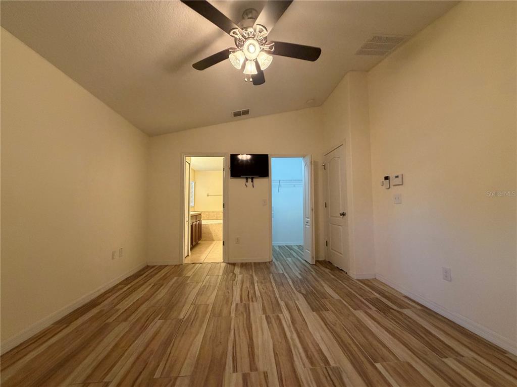 10214 Summer Azure Drive Riverview, FL 33578 - Photo 18 of 23 a view of empty room with wooden floor