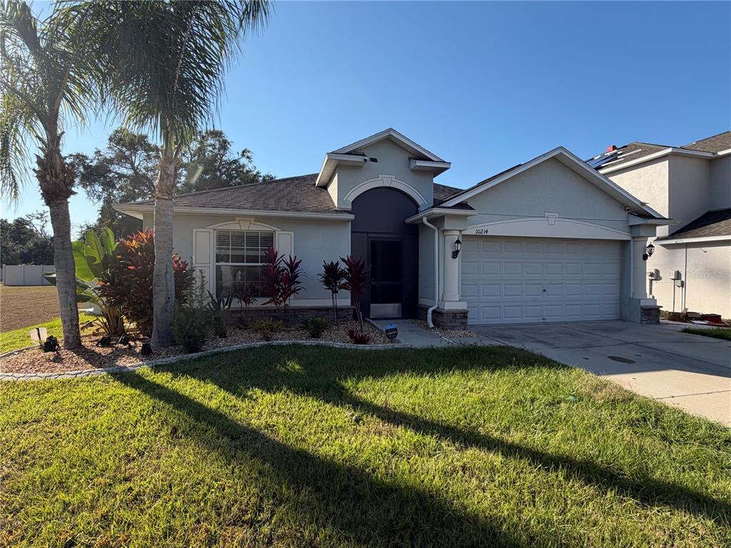 10214 Summer Azure Drive Riverview, FL 33578 - Photo 2 of 23 a view of a house with swimming pool and a yard