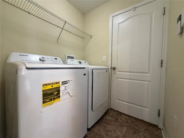 a utility room with dryer and washer