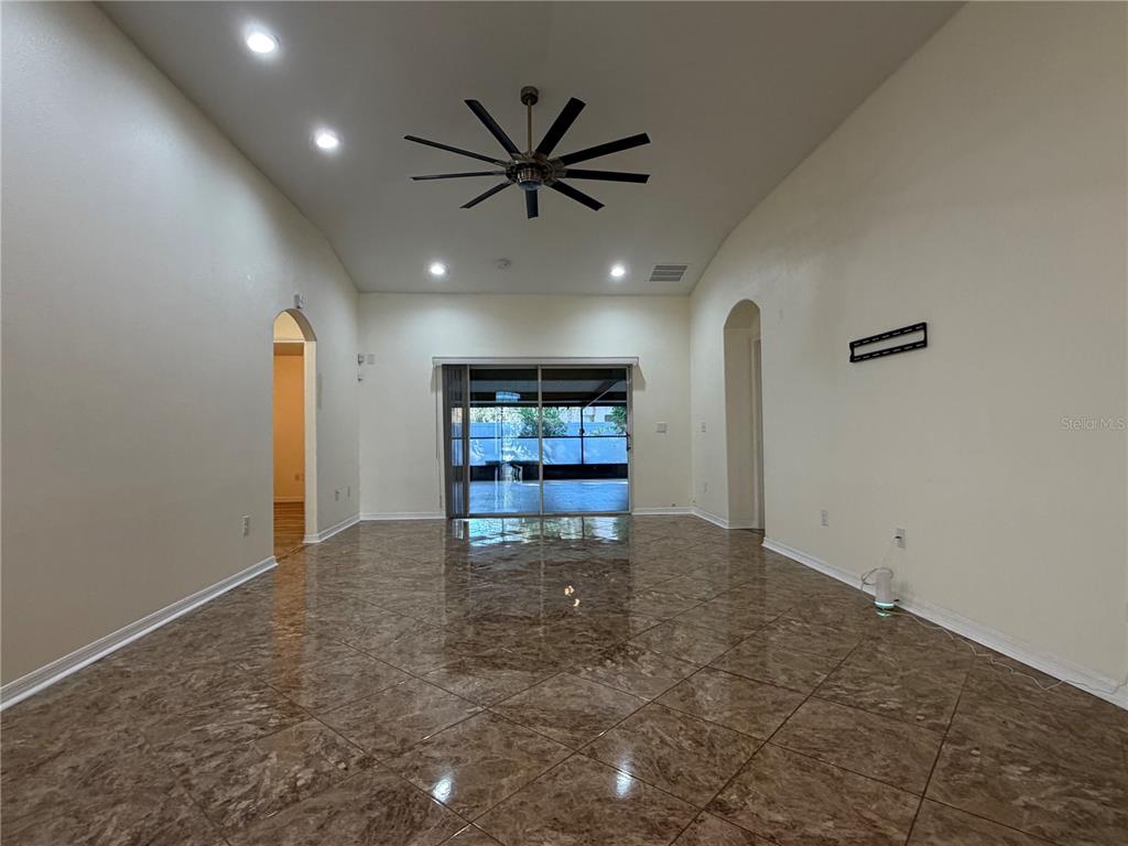 10214 Summer Azure Drive Riverview, FL 33578 - Photo 4 of 23 a view of livingroom with a ceiling fan and window