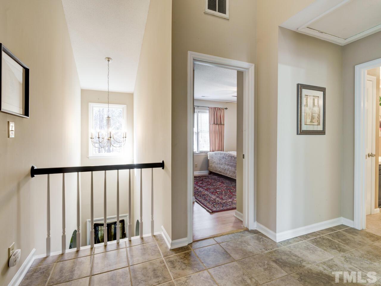 5933 Dunbarton Way Raleigh, NC 27613 - Photo 38 of 48 a view of a hallway with a bedroom and a bathroom