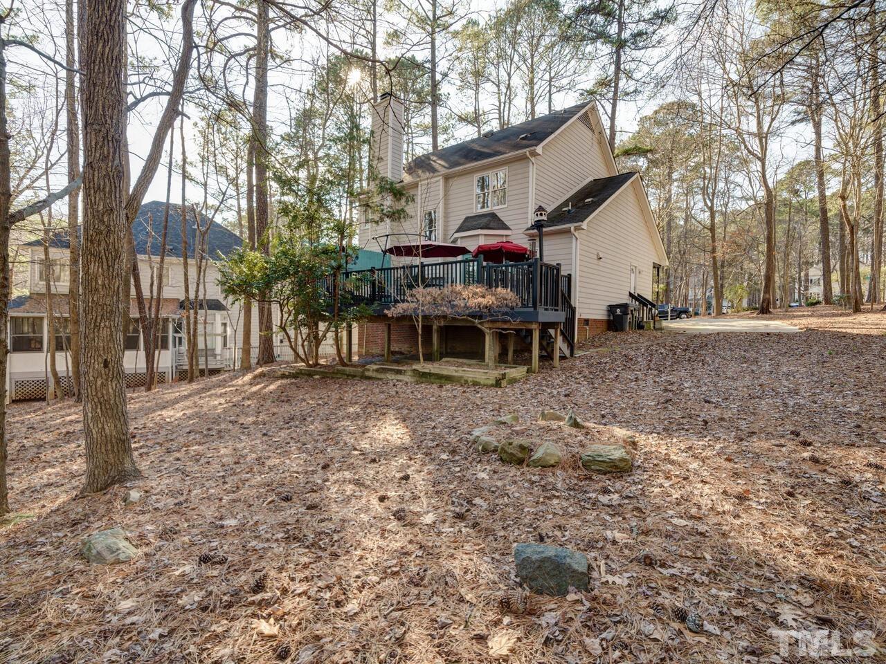 5933 Dunbarton Way Raleigh, NC 27613 - Photo 44 of 48 a view of a house with a yard and sitting area