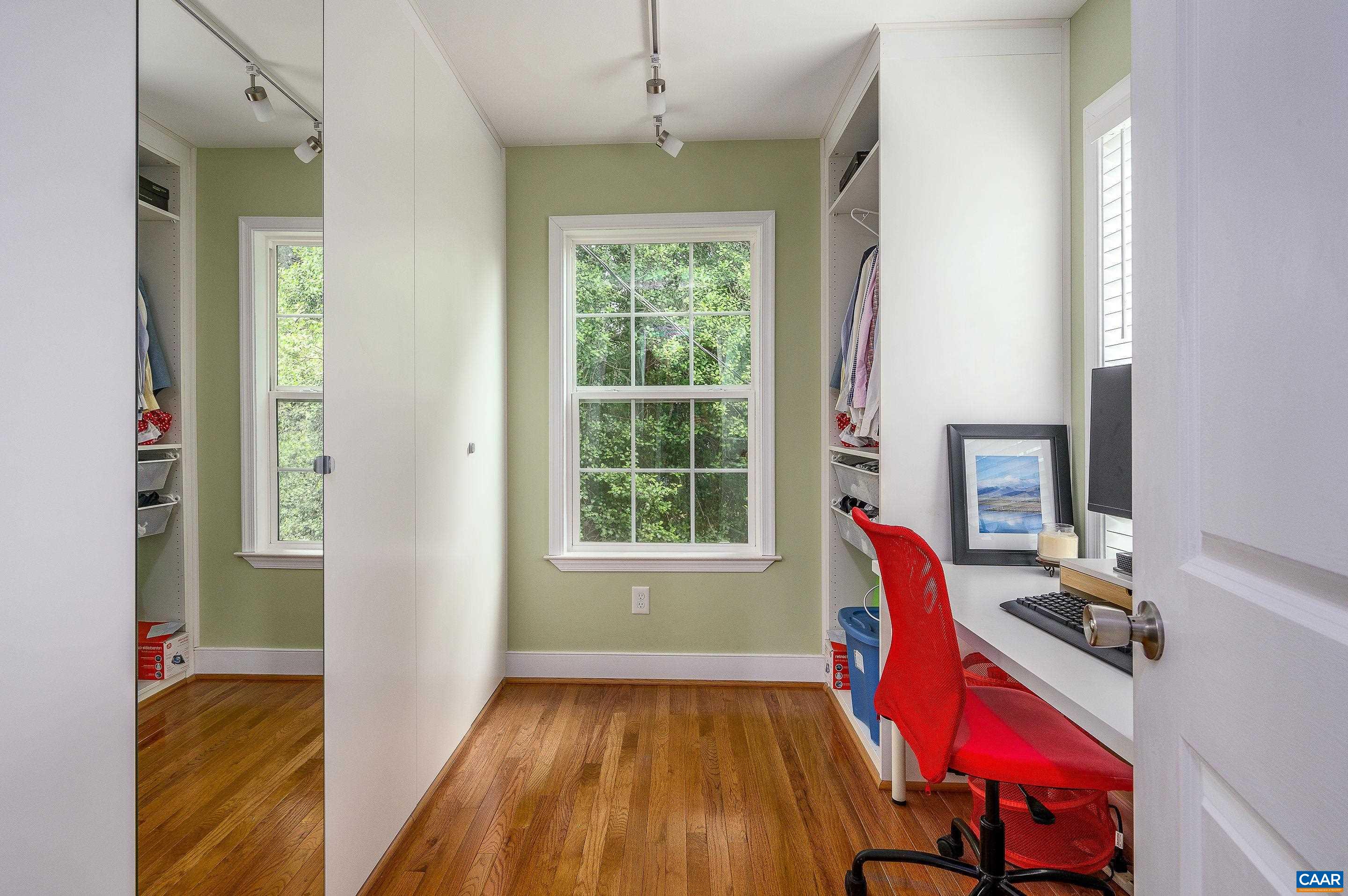 1939 Thomson Road Charlottesville, VA 22903 - Photo 17 of 35 a view of a workspace with furniture and a window