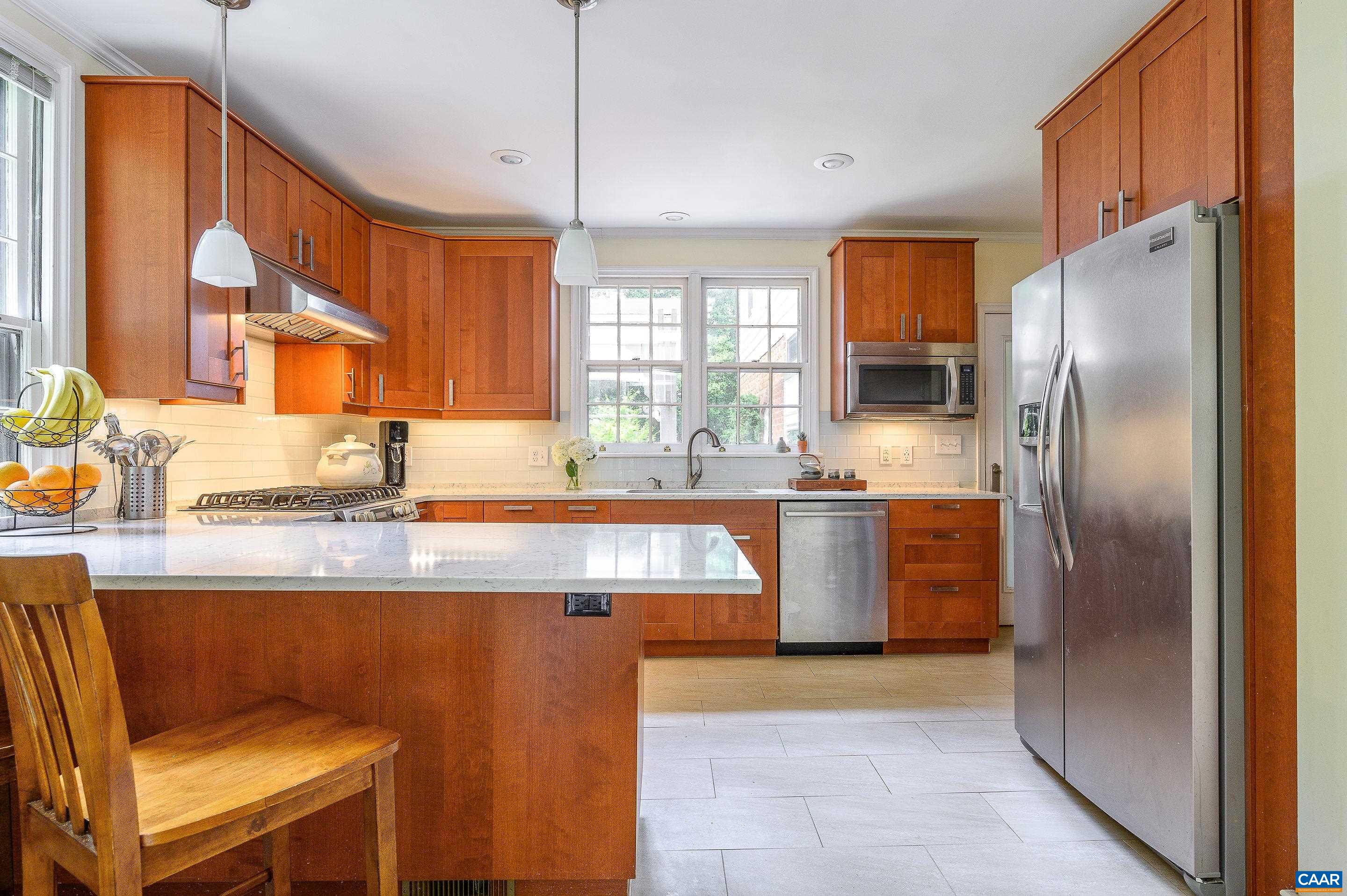 1939 Thomson Road Charlottesville, VA 22903 - Photo 6 of 35 a kitchen with stainless steel appliances granite countertop a sink stove and refrigerator