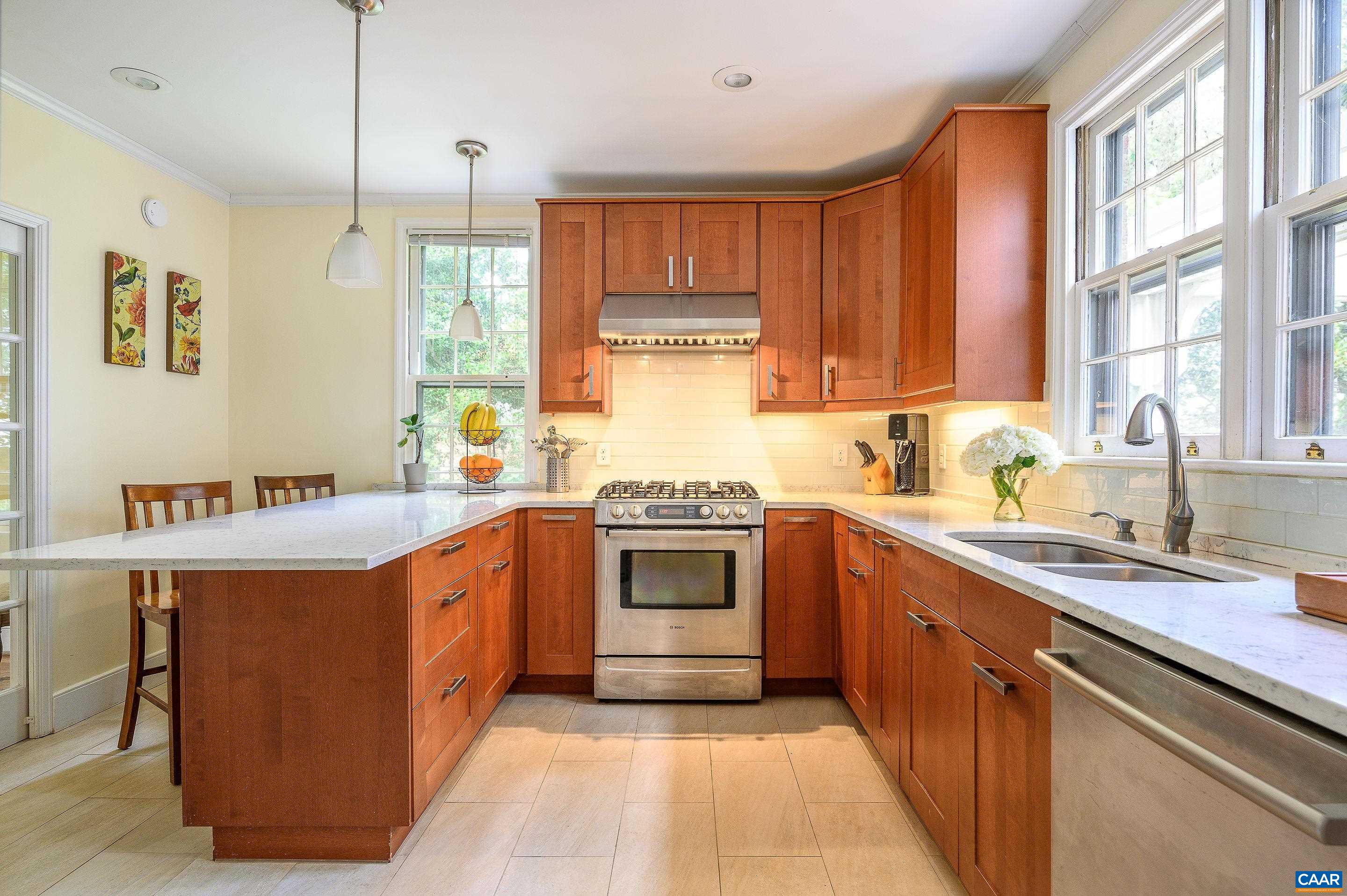 1939 Thomson Road Charlottesville, VA 22903 - Photo 7 of 35 a kitchen with stainless steel appliances granite countertop a stove and a sink