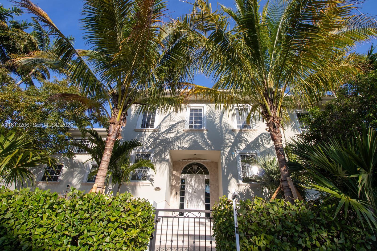 797 Ridgewood Road Key Biscayne, FL 33149 - Photo 1 of 23 a view of front of a house with a tree