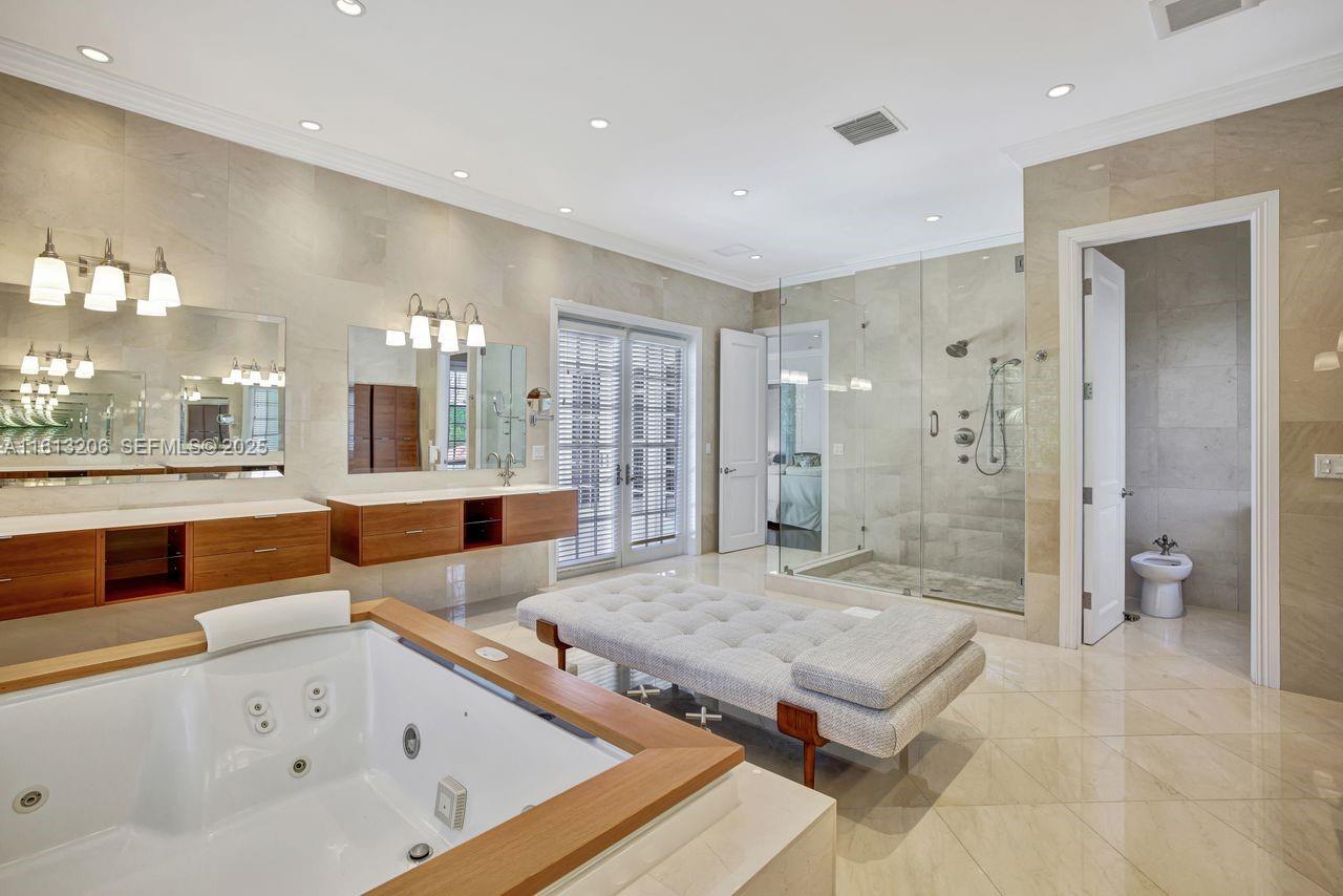 797 Ridgewood Road Key Biscayne, FL 33149 - Photo 12 of 23 a large bathroom with a tub and shower