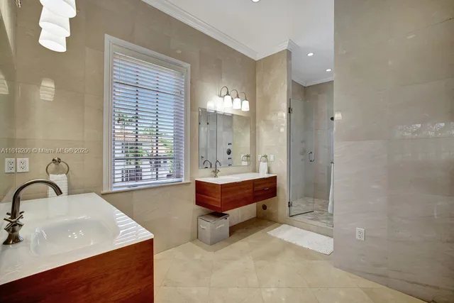 a spacious bathroom with a bathtub shower sink and mirror