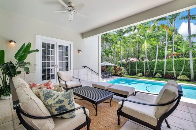 a living room with furniture and a yard