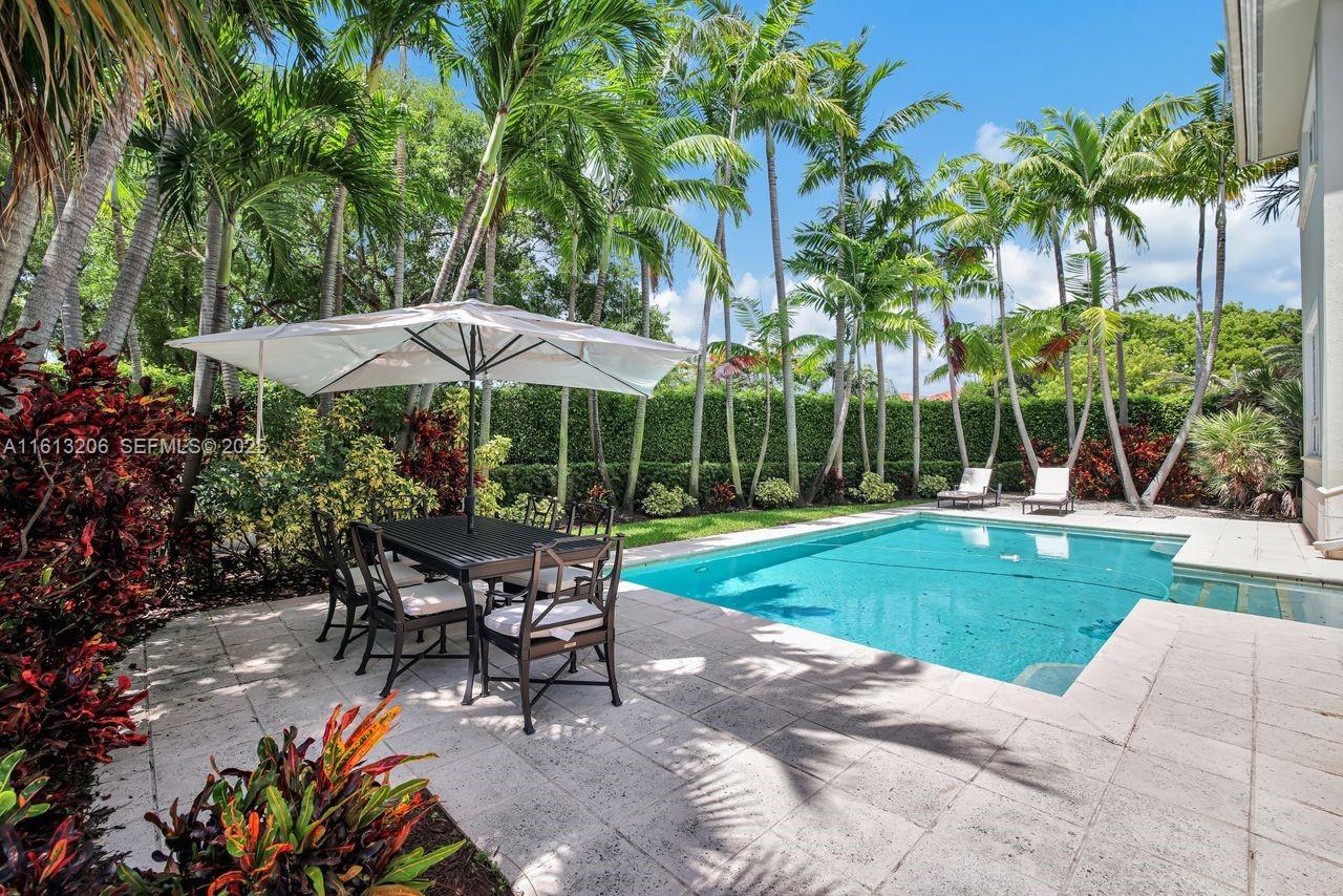 797 Ridgewood Road Key Biscayne, FL 33149 - Photo 18 of 23 a view of a sitting area with furniture and garden