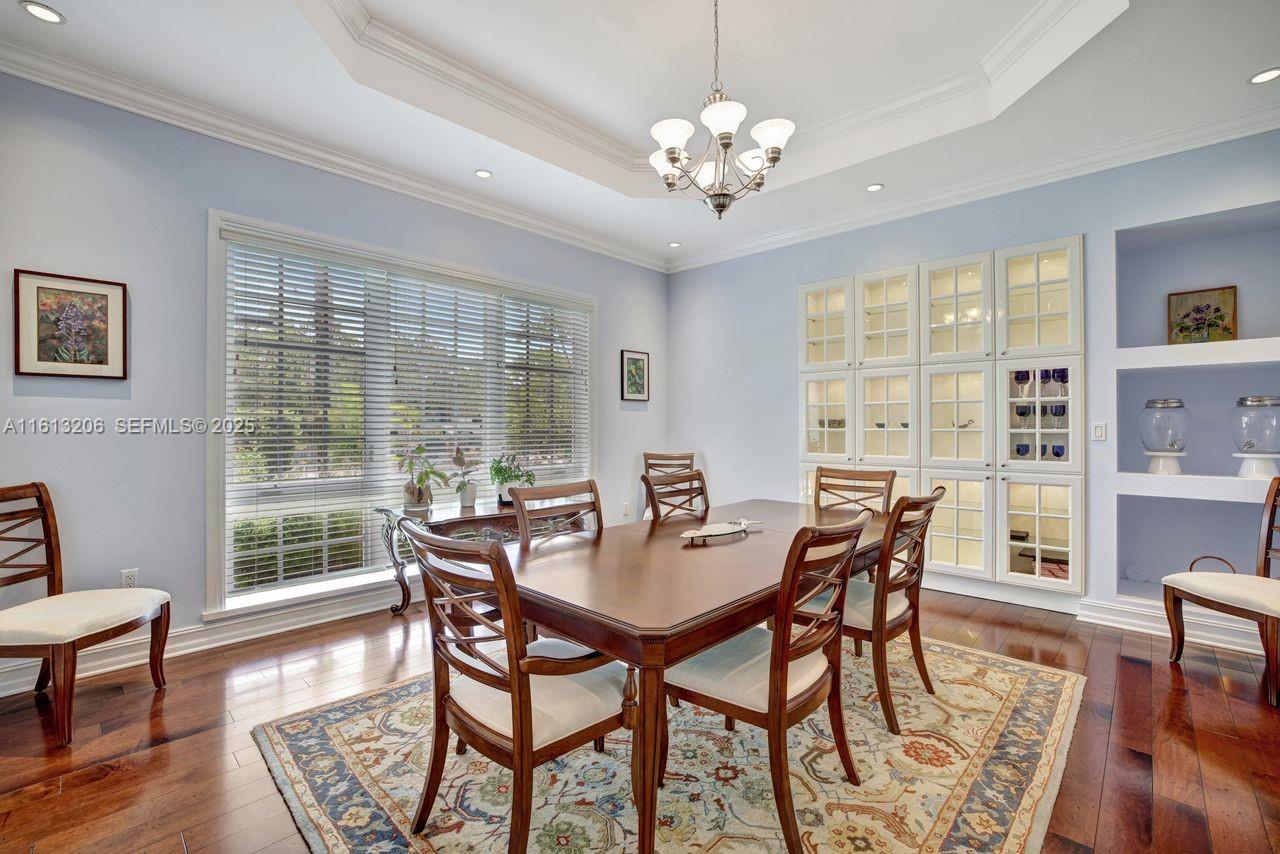 797 Ridgewood Road Key Biscayne, FL 33149 - Photo 6 of 23 a view of a dining room with furniture window and wooden floor