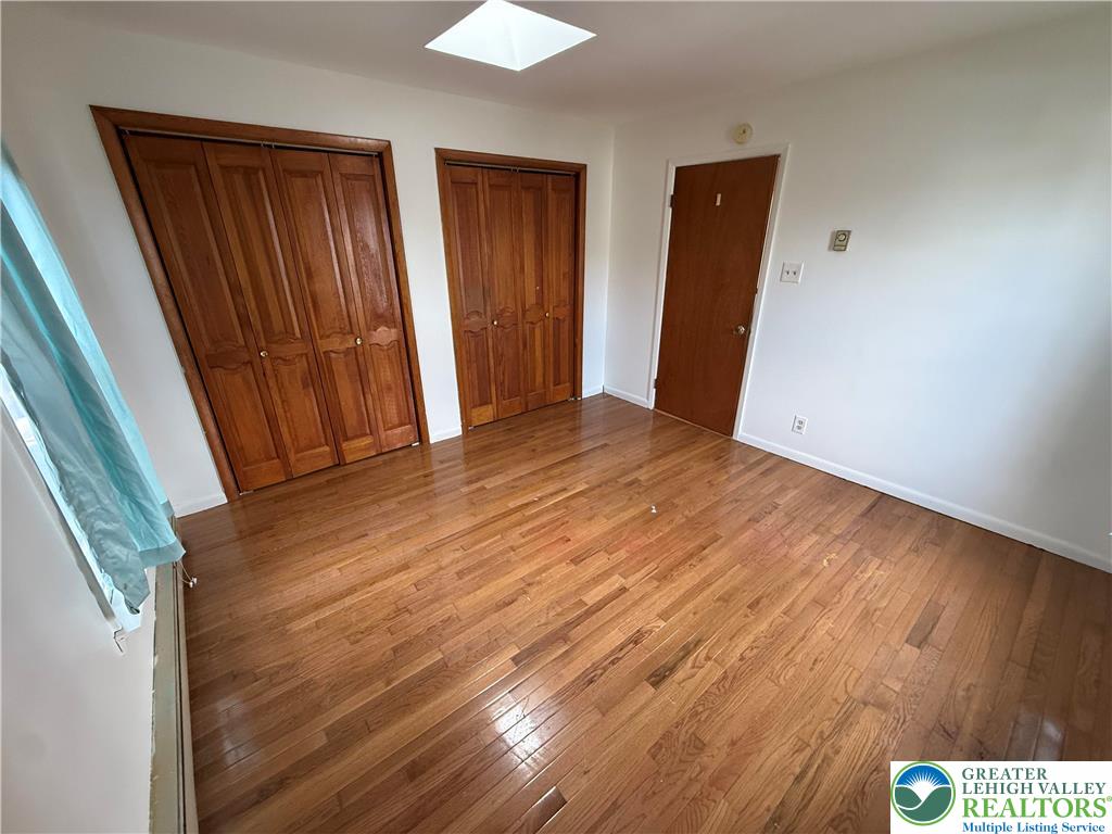 2955 Middletown Road Bethlehem, PA 18020 - Photo 13 of 20 Hardwood flooring extends throughout this versatile space, featuring ample closet storage and a ceiling skylight.