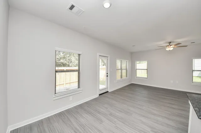 a room with a white wall and a white wall