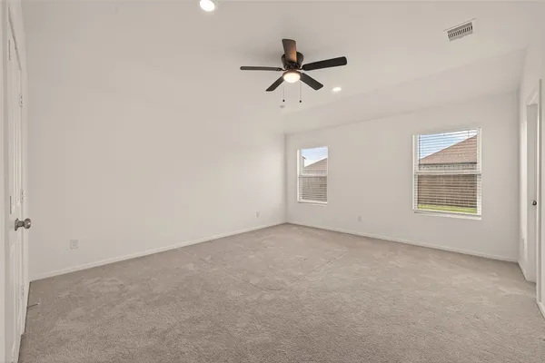 a view of empty room with windows