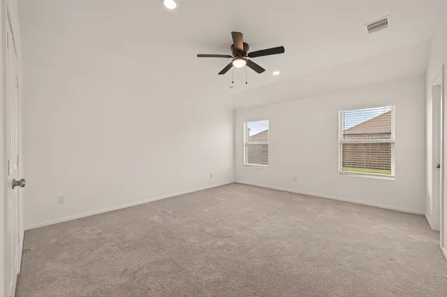 a view of empty room with windows