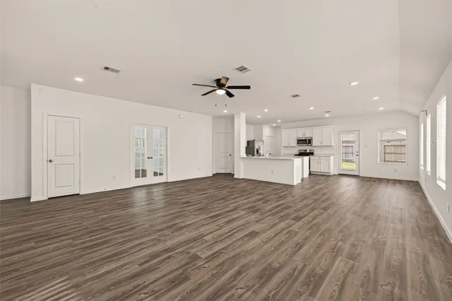 a view of a kitchen with a sink and a stove top oven