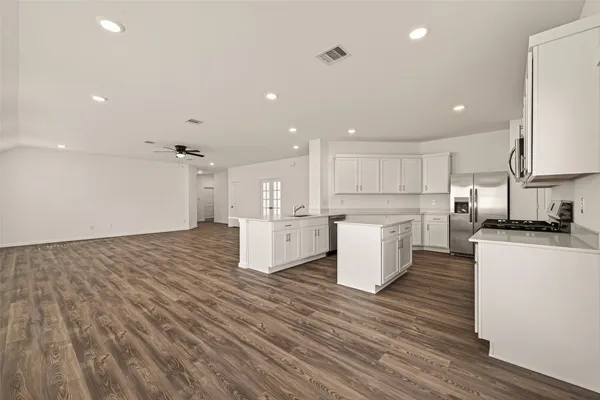 a view of kitchen with wooden floor