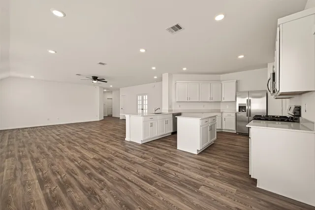 a view of kitchen with wooden floor
