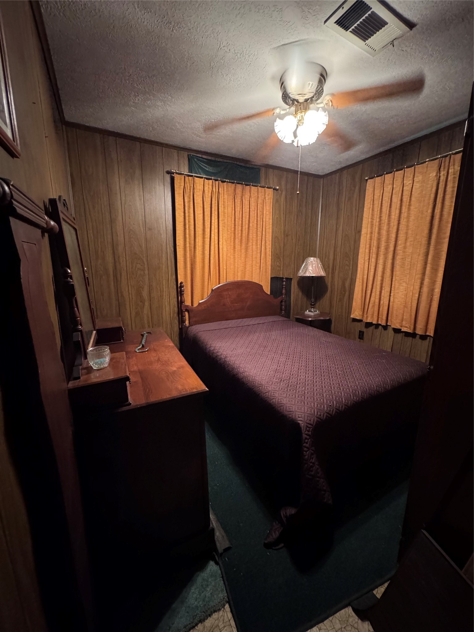 479 County Road Goodrich, TX 77335 - Photo 12 of 16 a bedroom with a bed and a chandelier