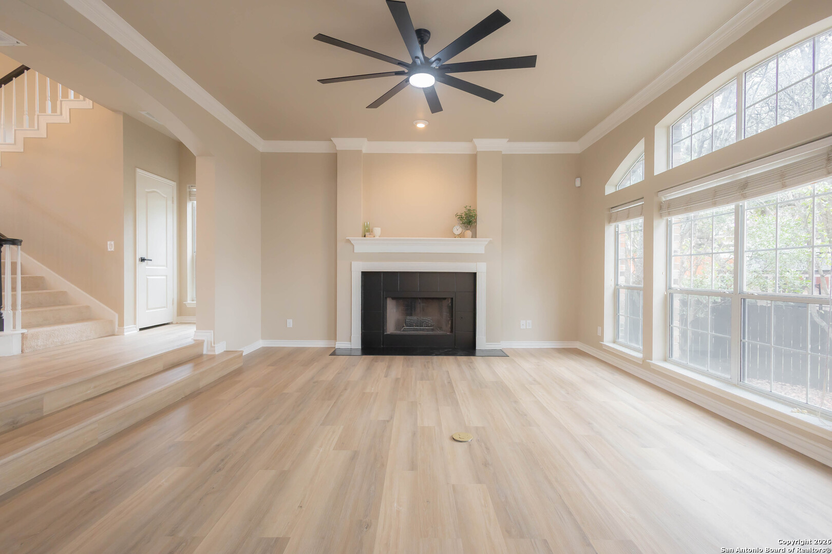18202 Crystal Ridge Drive San Antonio, TX 78259 - Photo 12 of 53 a view of an empty room with a fireplace and a window