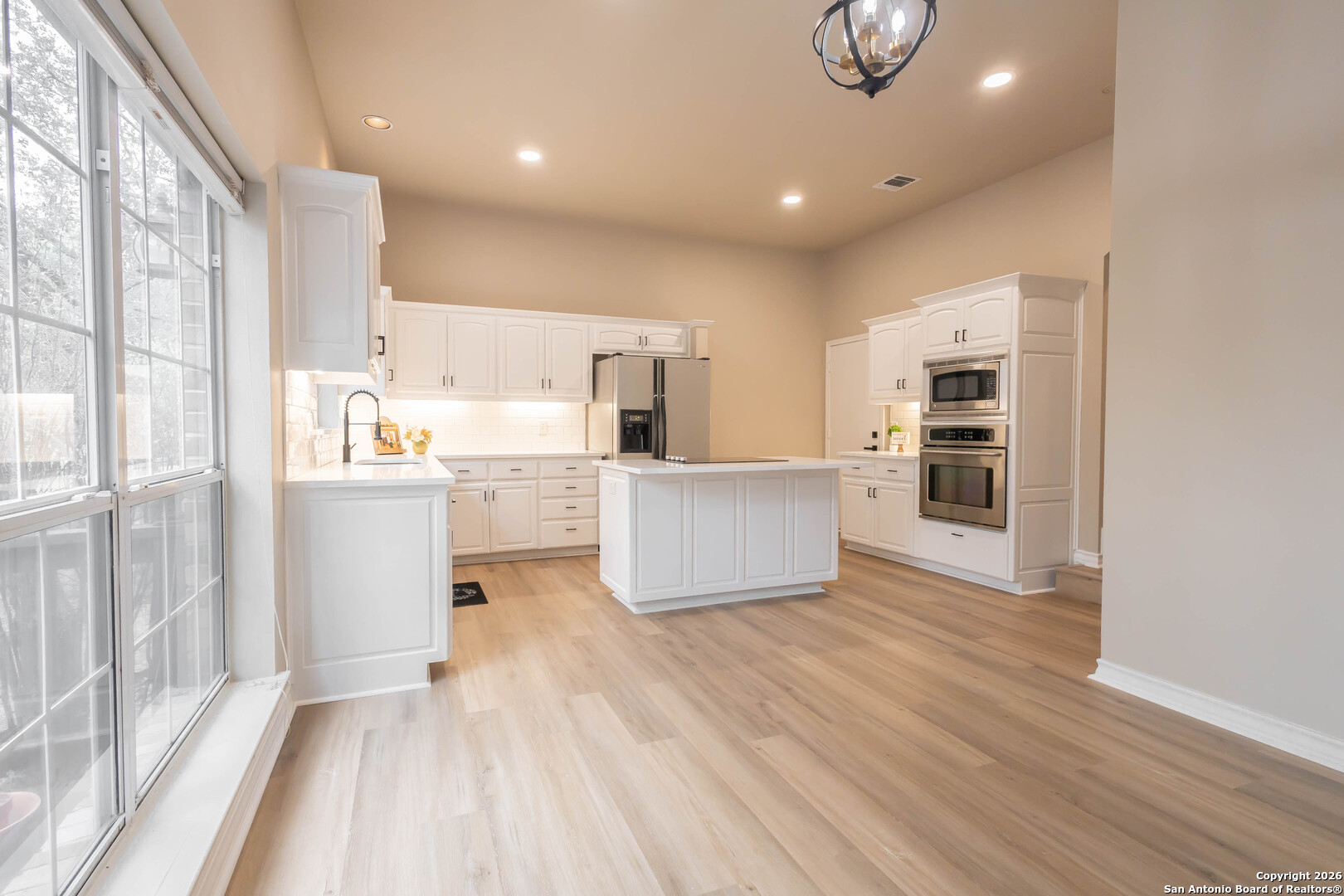 18202 Crystal Ridge Drive San Antonio, TX 78259 - Photo 15 of 53 a view of kitchen with wooden floor and electronic appliances