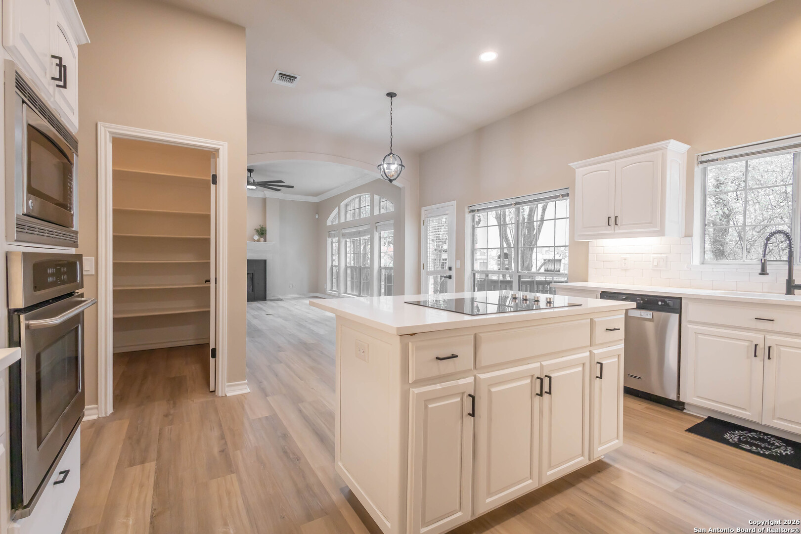 18202 Crystal Ridge Drive San Antonio, TX 78259 - Photo 17 of 53 a kitchen with cabinets oven and a dishwasher