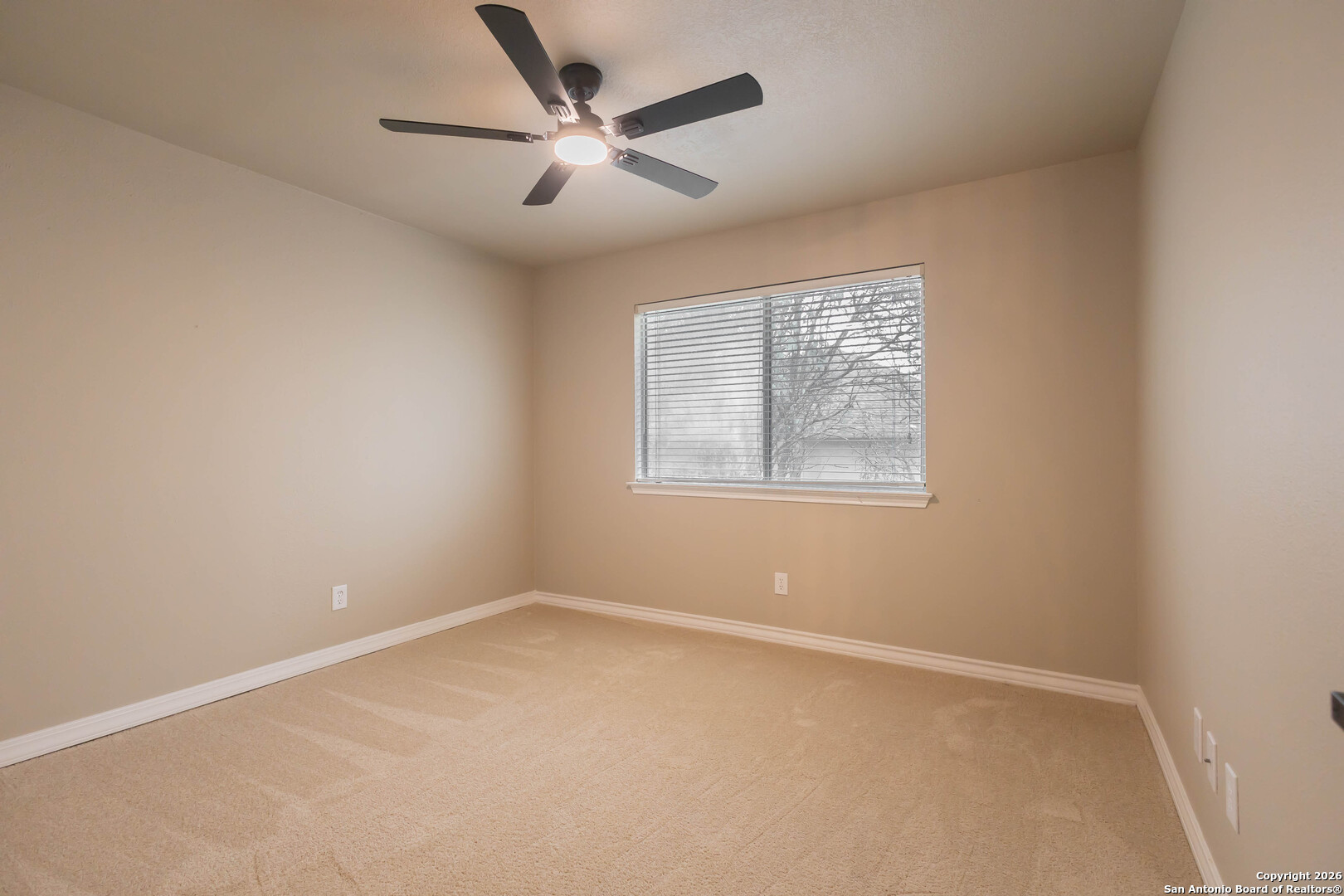 18202 Crystal Ridge Drive San Antonio, TX 78259 - Photo 20 of 53 an empty room with a window and ceiling fan