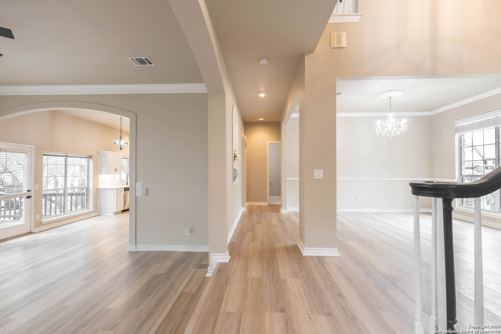 18202 Crystal Ridge Drive San Antonio, TX 78259 - Photo 23 of 53 a view of a hallway with wooden floor and a living room