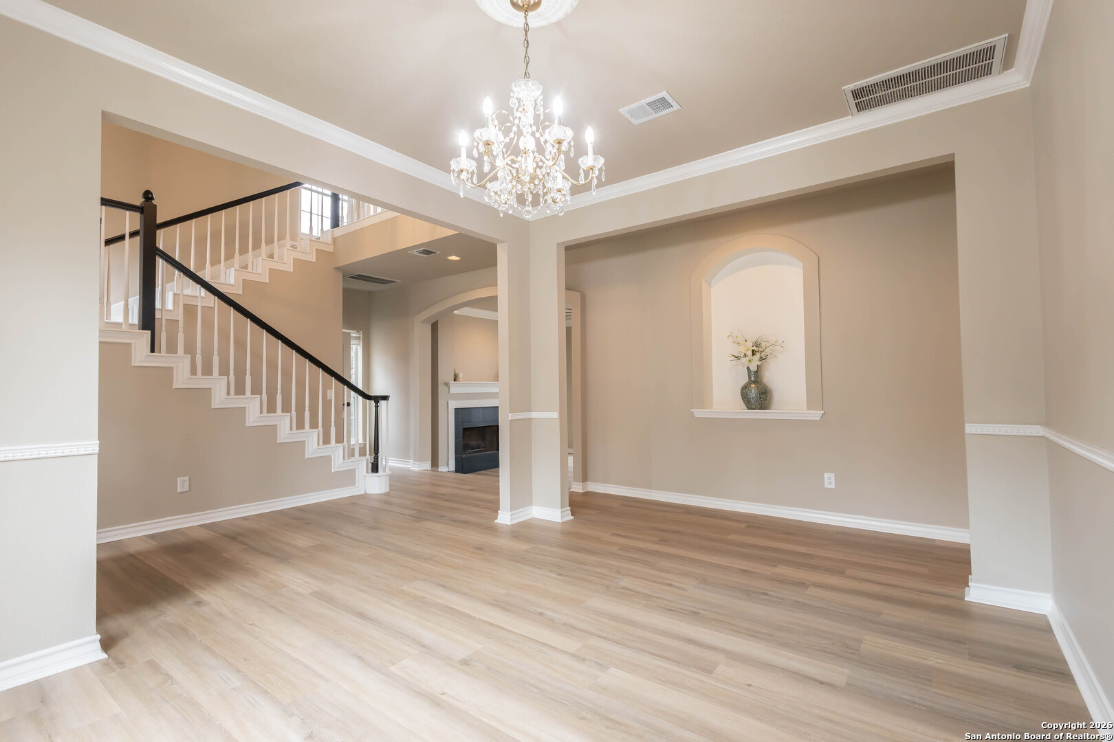 18202 Crystal Ridge Drive San Antonio, TX 78259 - Photo 27 of 53 a view of a hallway with wooden floor and staircase