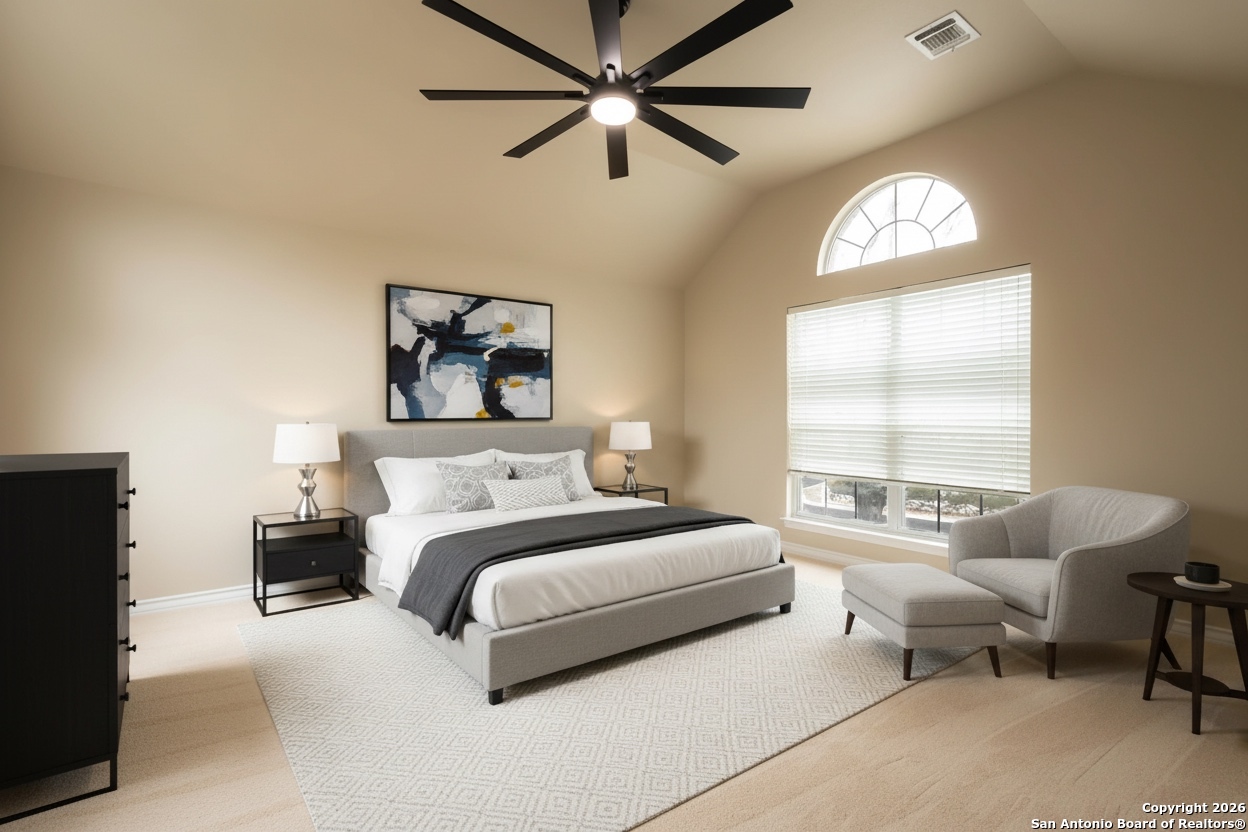 18202 Crystal Ridge Drive San Antonio, TX 78259 - Photo 29 of 53 a spacious bedroom with a bed and a window
