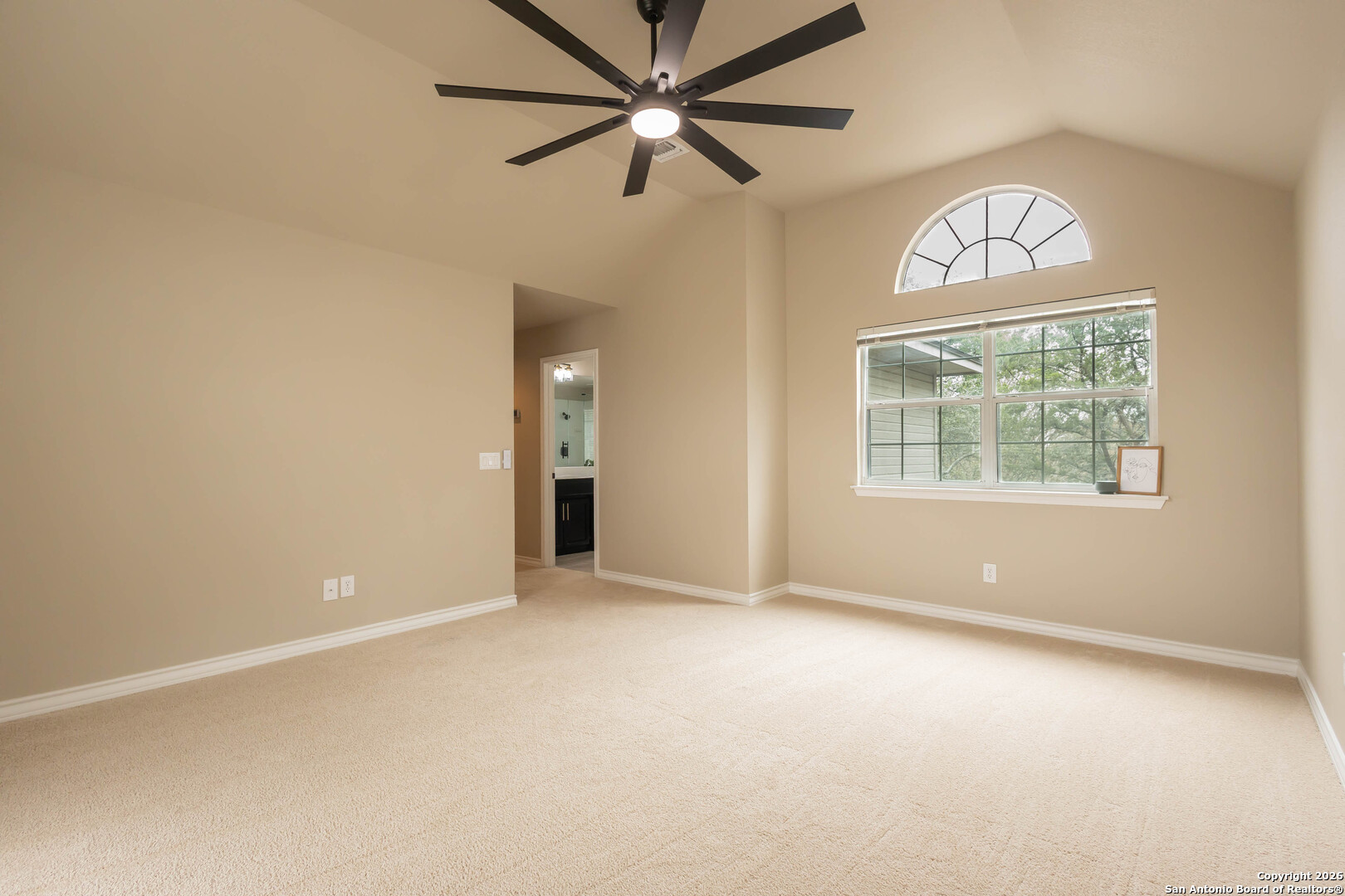 18202 Crystal Ridge Drive San Antonio, TX 78259 - Photo 30 of 53 an empty room with windows and fan