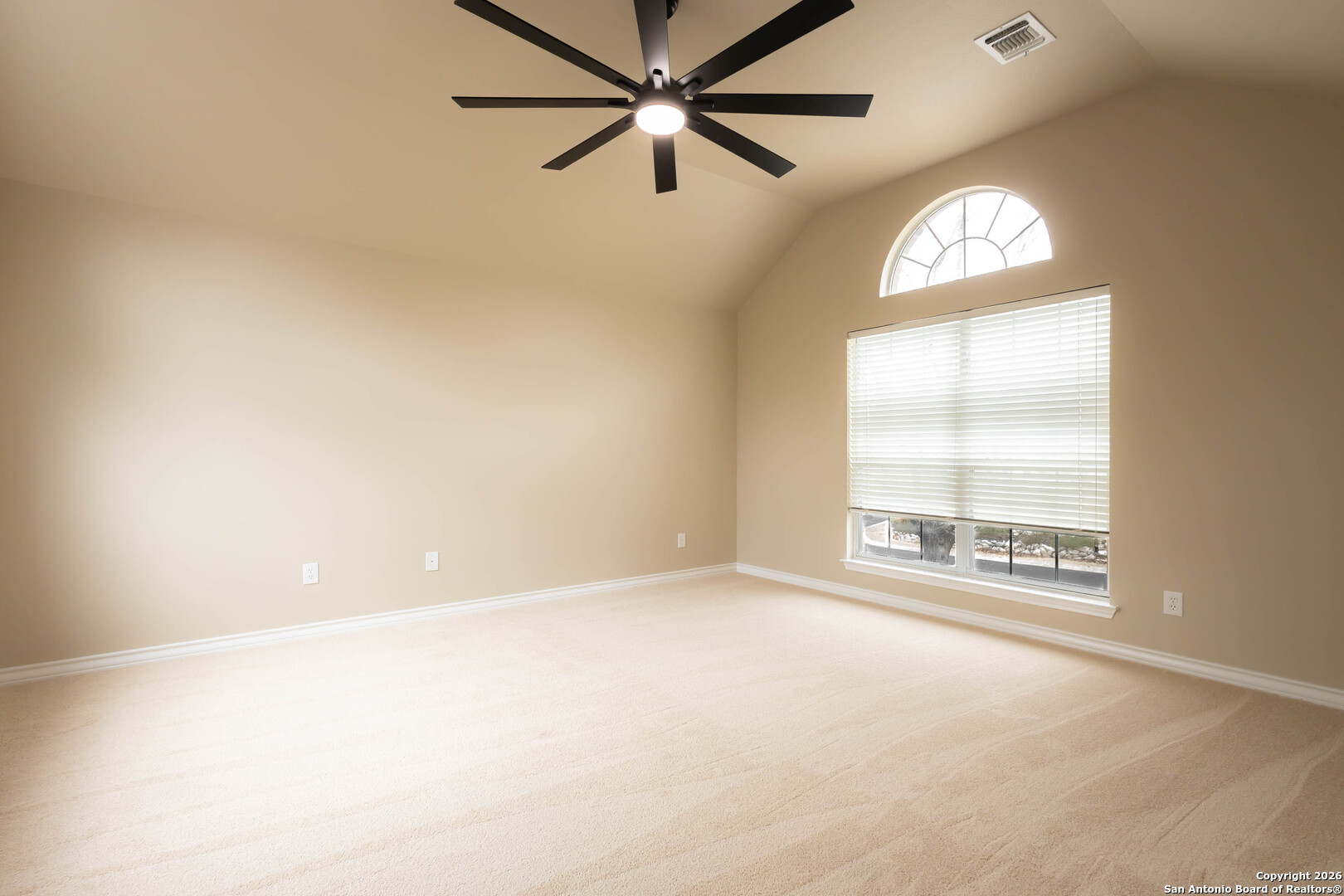 18202 Crystal Ridge Drive San Antonio, TX 78259 - Photo 31 of 53 an empty room with a window and a ceiling fan