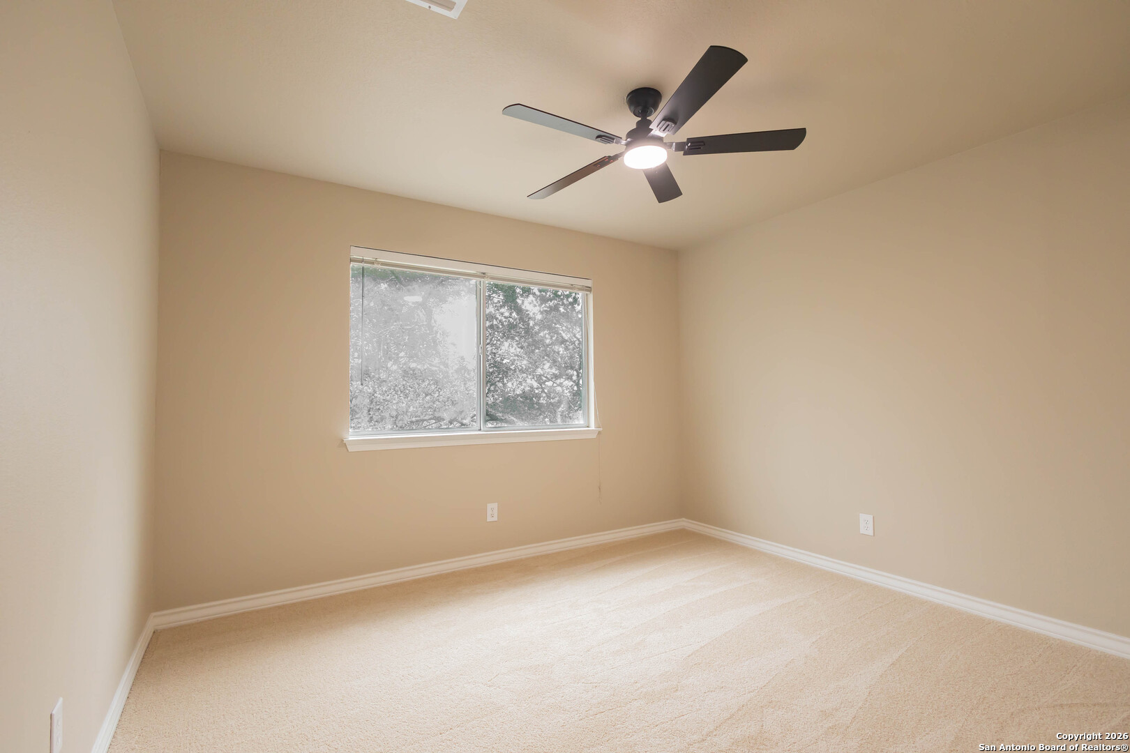 18202 Crystal Ridge Drive San Antonio, TX 78259 - Photo 39 of 53 an empty room with a window and a fan
