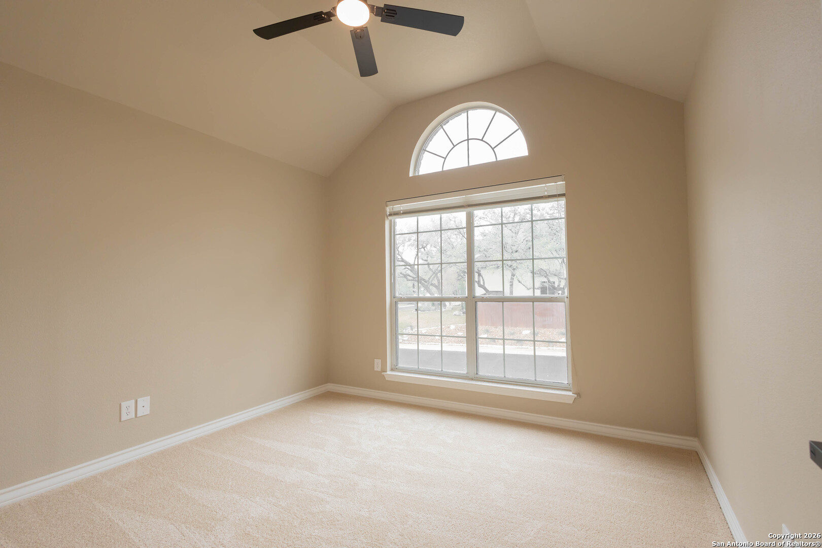 18202 Crystal Ridge Drive San Antonio, TX 78259 - Photo 41 of 53 an empty room with a window and a chandelier