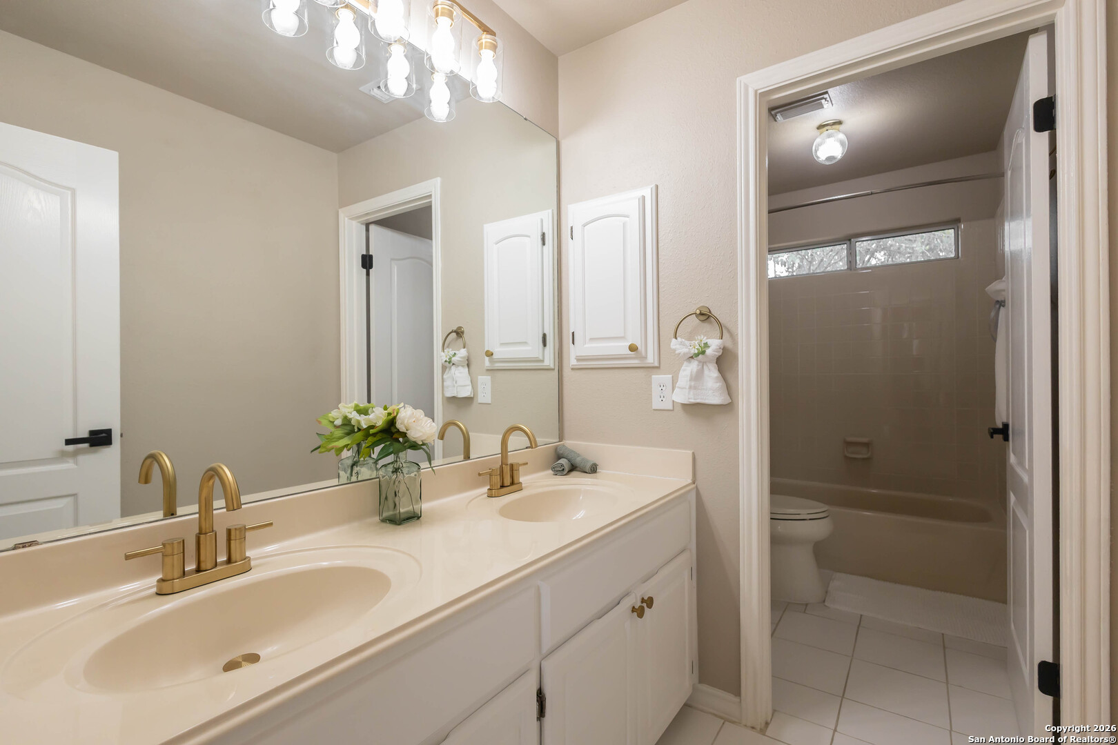 18202 Crystal Ridge Drive San Antonio, TX 78259 - Photo 44 of 53 a bathroom with a double vanity sink mirror and double