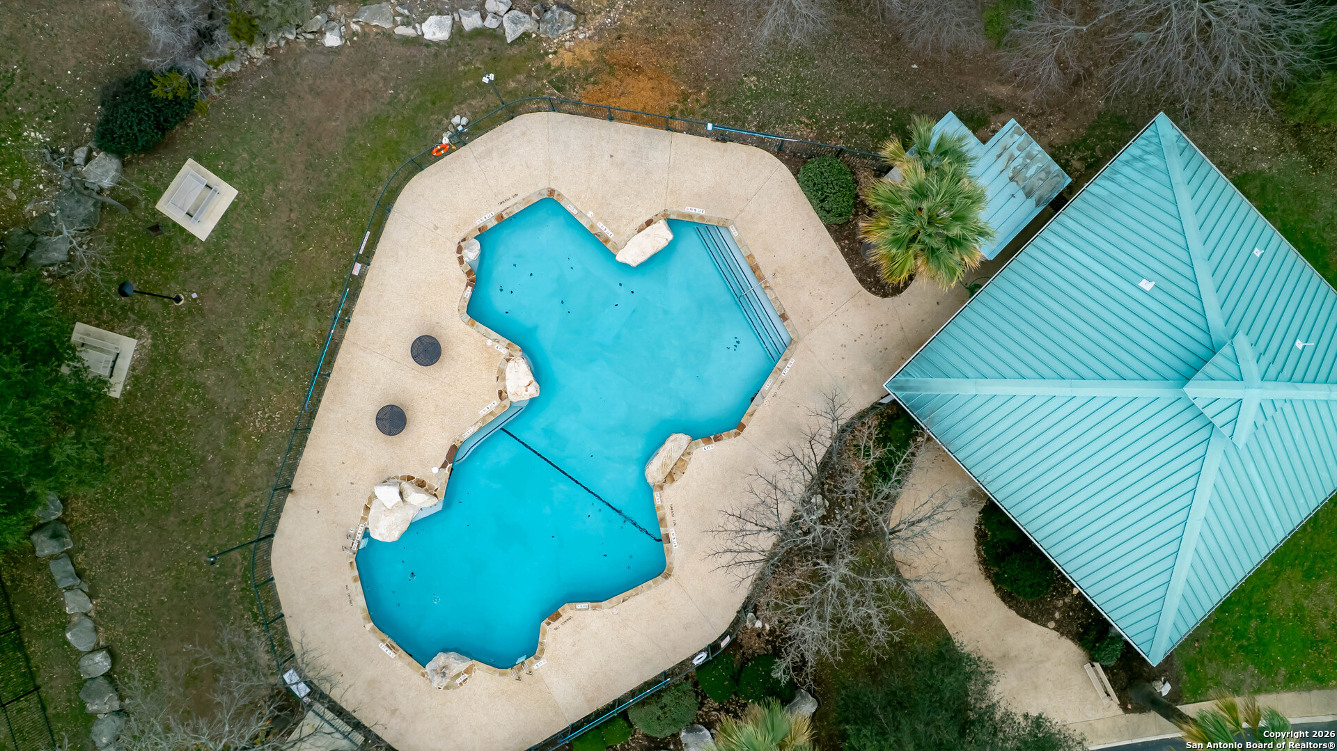 18202 Crystal Ridge Drive San Antonio, TX 78259 - Photo 52 of 53 a view of swimming pool with a garden and plants
