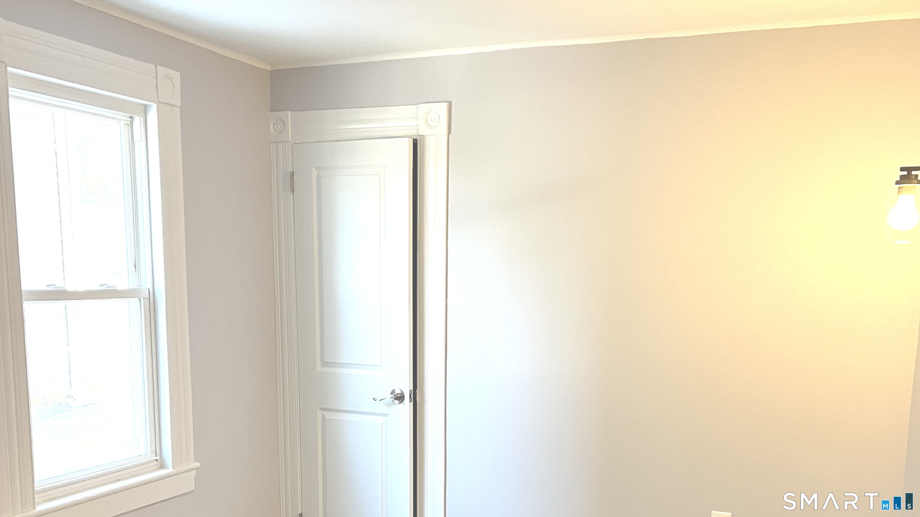 65 Chambers Street, Unit 1 Waterbury, CT 06708 - Photo 10 of 11 a view of a room that has a window in it