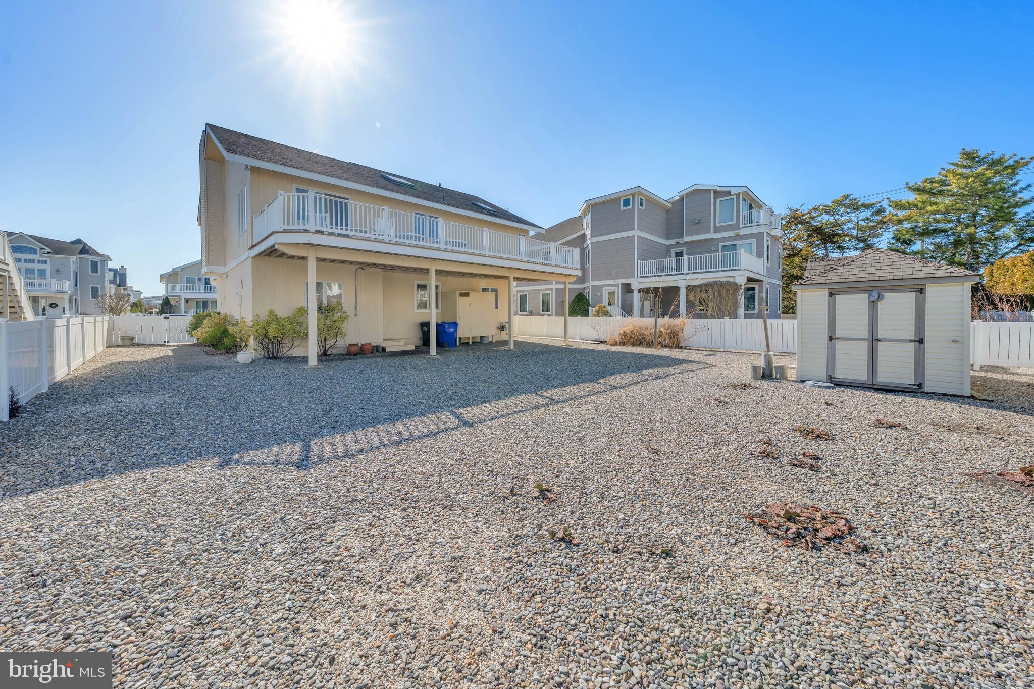177 74th Street Avalon, NJ 08202 - Photo 13 of 54 a front view of a house with a yard