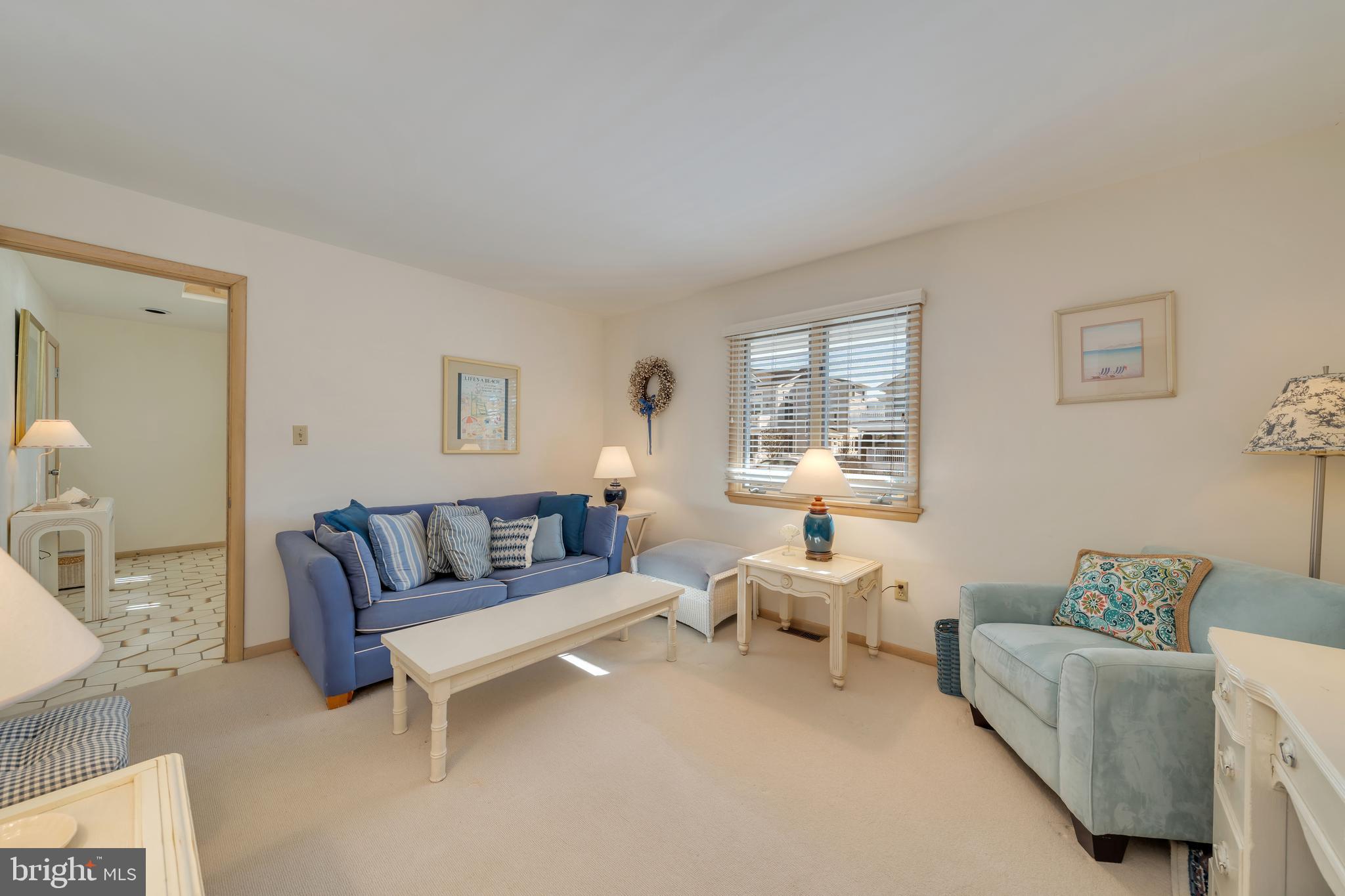 177 74th Street Avalon, NJ 08202 - Photo 27 of 54 a living room with furniture and a large window
