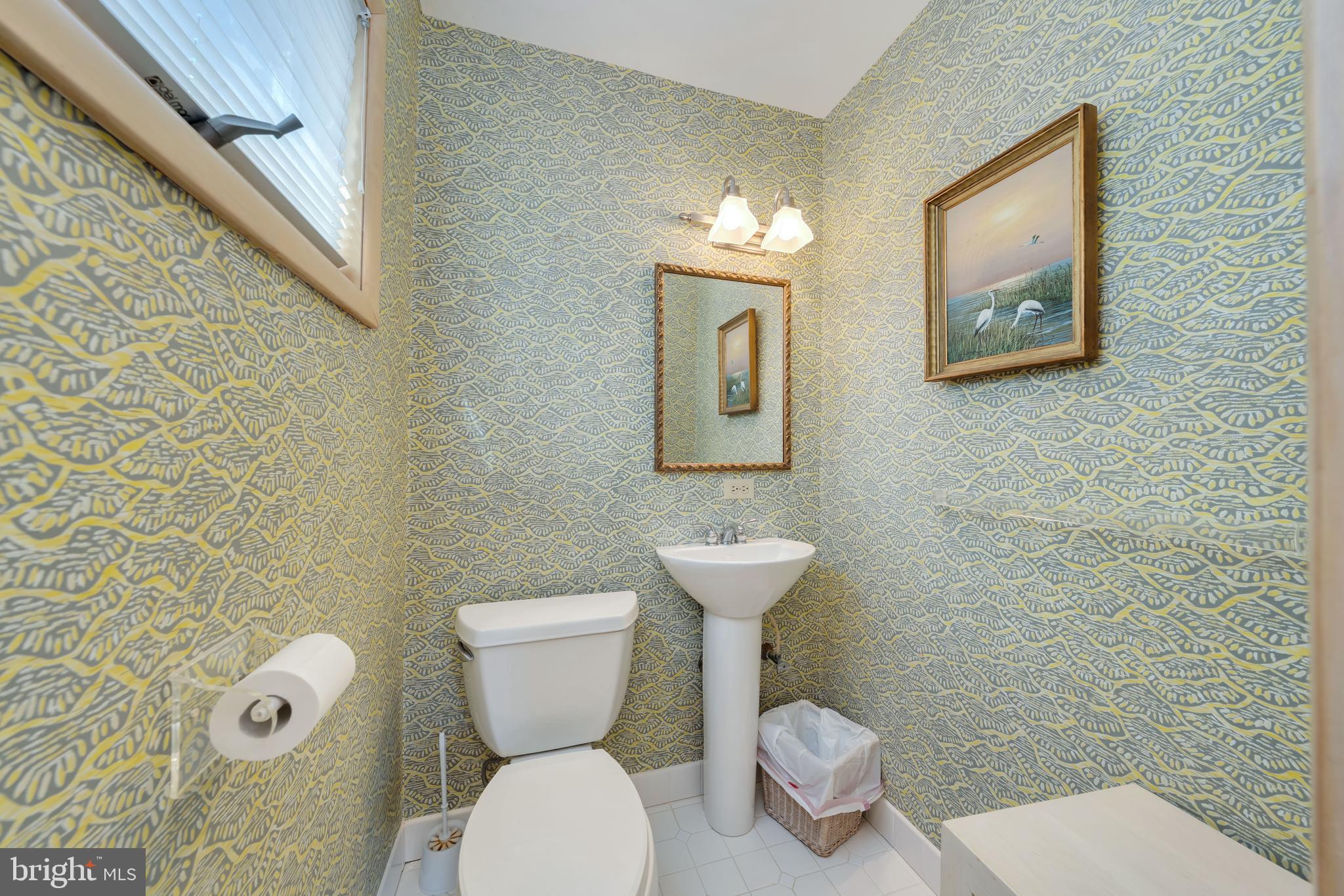 177 74th Street Avalon, NJ 08202 - Photo 28 of 54 a white toilet sitting next to a bathroom sink