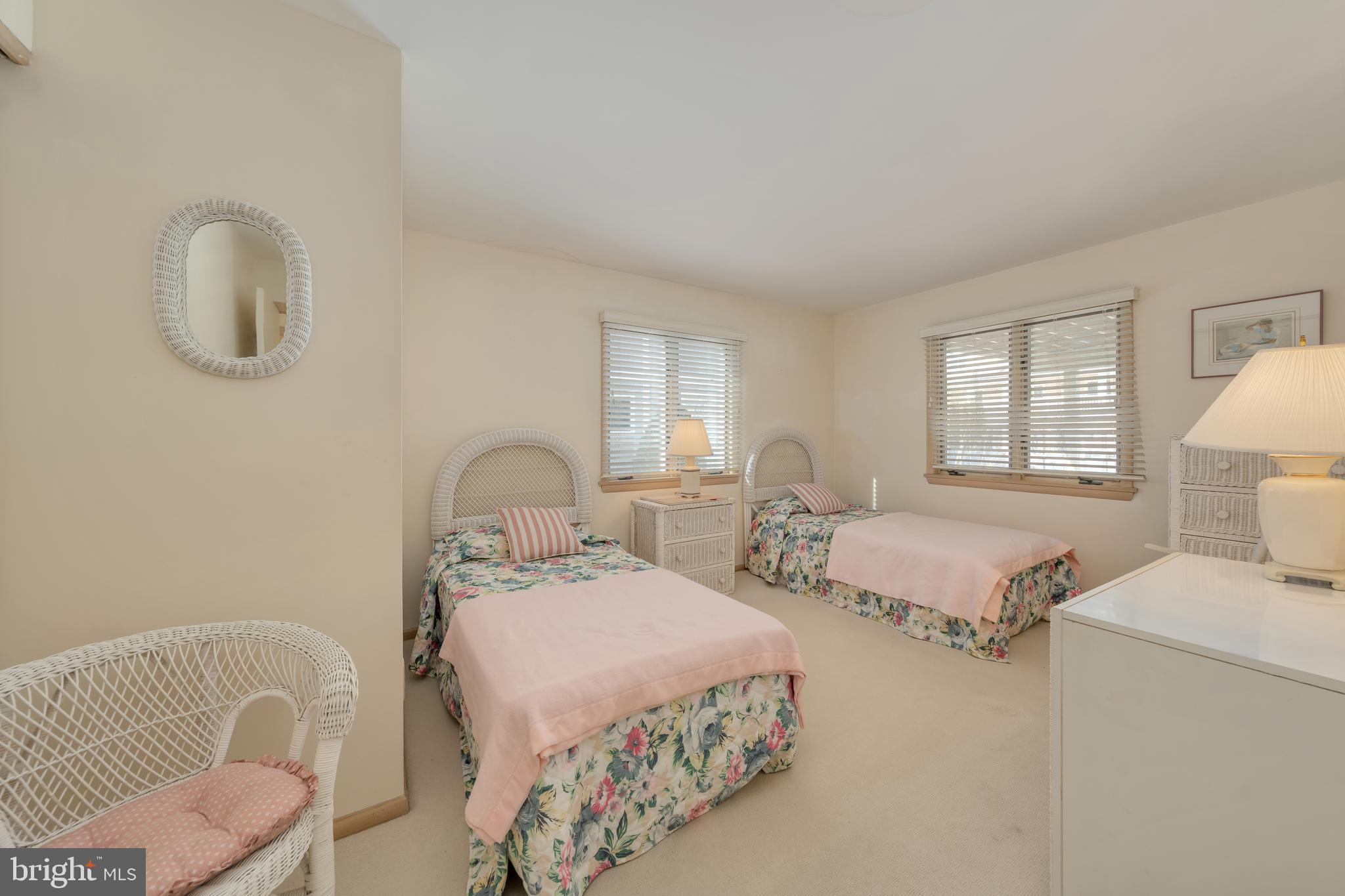 177 74th Street Avalon, NJ 08202 - Photo 30 of 54 a bedroom with two beds and painting on the wall