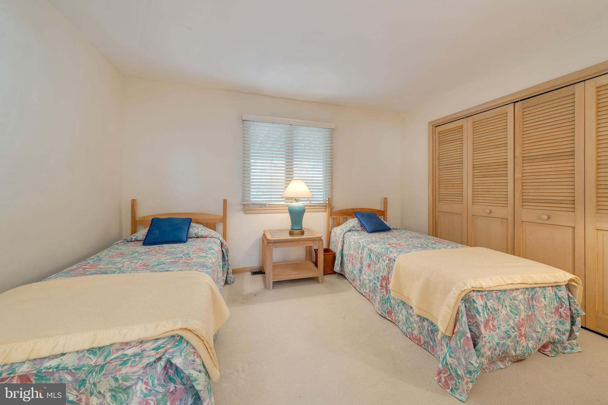 177 74th Street Avalon, NJ 08202 - Photo 31 of 54 a bedroom with a bed and wooden floor