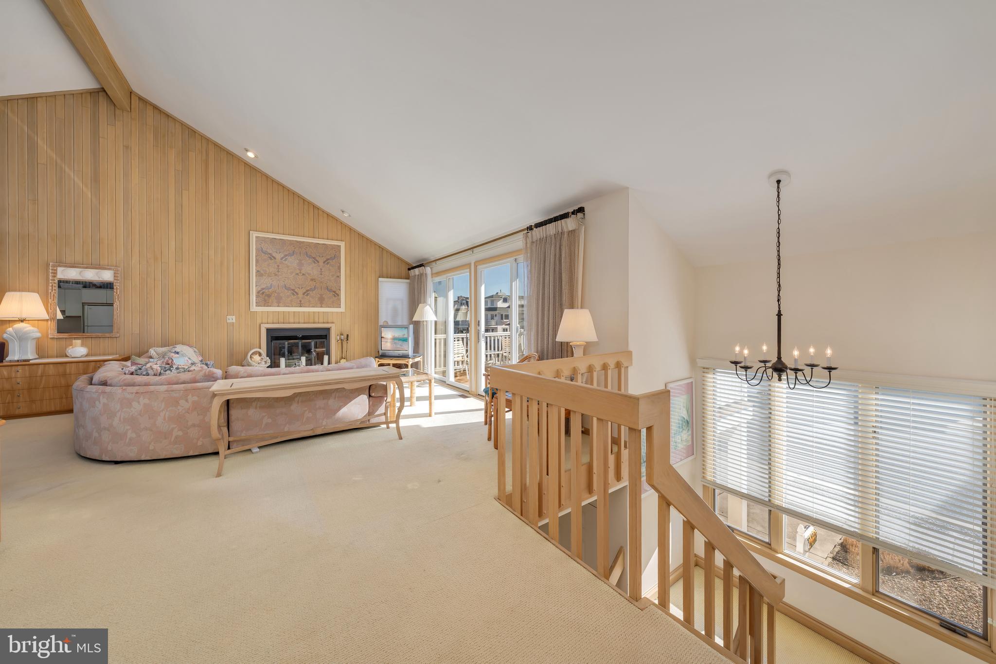 177 74th Street Avalon, NJ 08202 - Photo 33 of 54 a living room with furniture and a large window