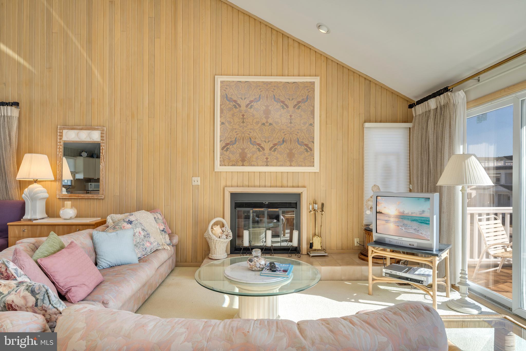 177 74th Street Avalon, NJ 08202 - Photo 34 of 54 a living room with furniture and a fireplace