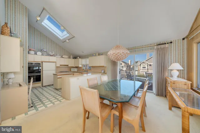 a kitchen with cabinets and white appliances